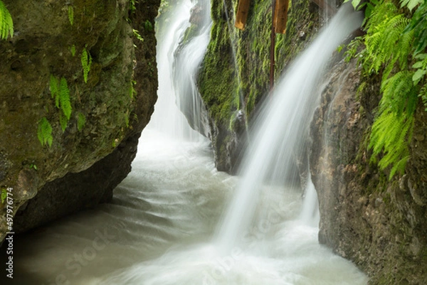Obraz waterfall in the mountains of Chechnya in the spring in a picturesque forest