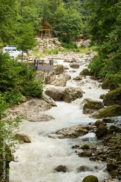 Fototapeta holiday house in the mountains of Chechnya in the spring among the mountains and forests near the river and lake