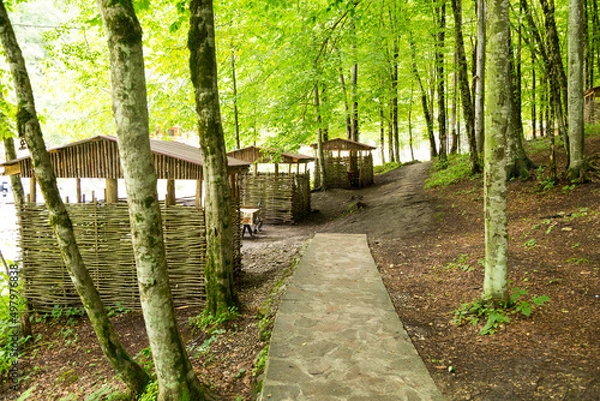 Fototapeta holiday house in the mountains of Chechnya in the spring among the mountains and forests near the river and lake