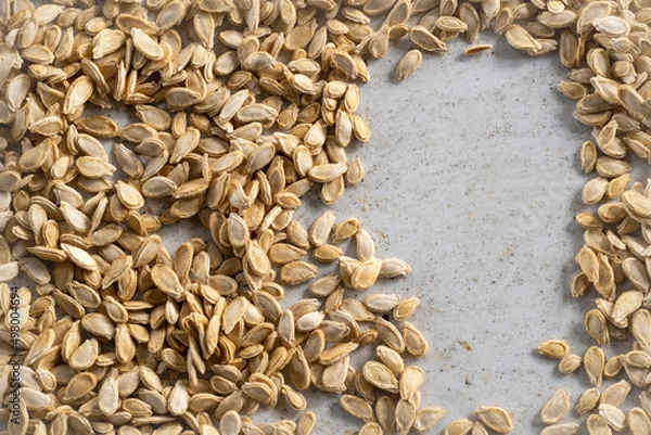 Fototapeta Pumpkin seeds on a white background