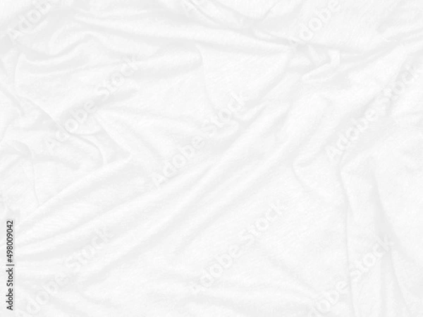 Fototapeta white creased fabric texture background, empty white cloth use as wallpaper. simple wavy t-shirt structure, plain fashion clothes unprinted design. luxury, softness concept background.