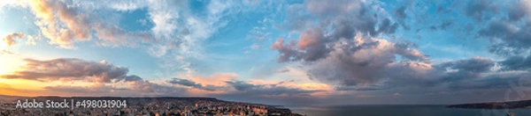 Obraz Panoramic view of amazing sunset sky over the city