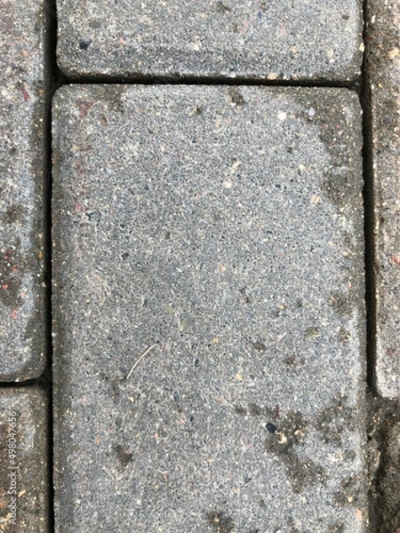 Obraz The pavement with granite texture. Gray stone sidewalk texture.