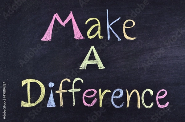 Obraz "make a difference" handwritten on blackboard