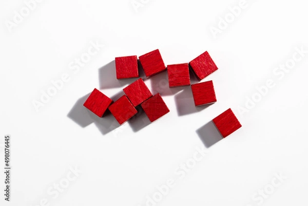 Fototapeta Top View of Red Wooden Game Cubes on White Background