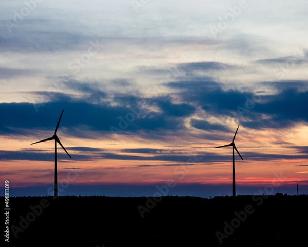 Fototapeta wind turbines at sunset