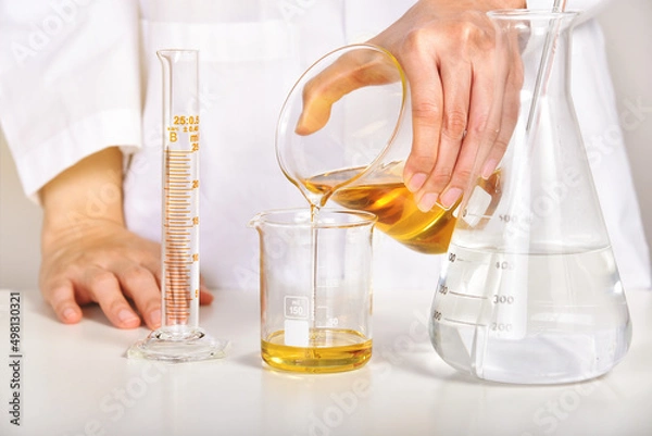 Fototapeta Oil pouring, Laboratory and science experiments, Formulating the chemical for medical research, Quality control of petroleum industry products concept.