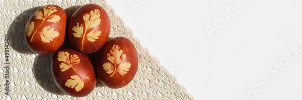 Obraz Panoramic photo. Top view of easter eggs, lying on lace tablecloth. Tradition and rustic arrangement. Easter concept. Copy space.