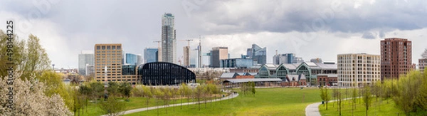 Fototapeta Panoramic cityscape of Brussels city center and economic district with skyscrapers in spring on a sunny day with a dramatic sky and a green park in the foreground