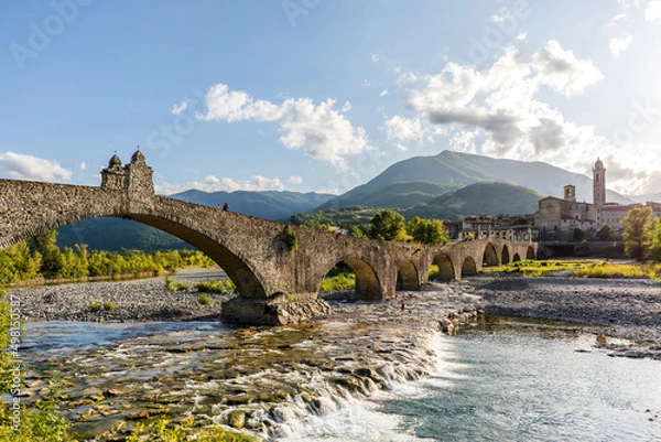 Fototapeta Panoramic view of The Hampback Bridge in Bobbio, Emilia Romagna region, Italy.