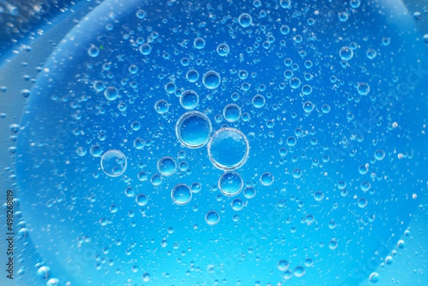 Fototapeta abstract light blue background with oil circles . bubbles of water close up .