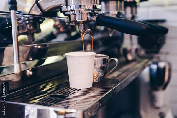 Obraz Close-up of espresso pouring from coffee machine. Concept coffee in cafe