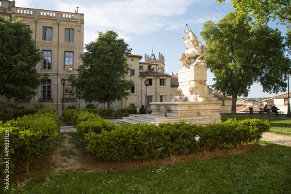 Fototapeta Montpellier, France: Place de la Canourgue - a charming and quiet square in the centre of the historic district with a small garden and a beautiful statue in the form of a horse.