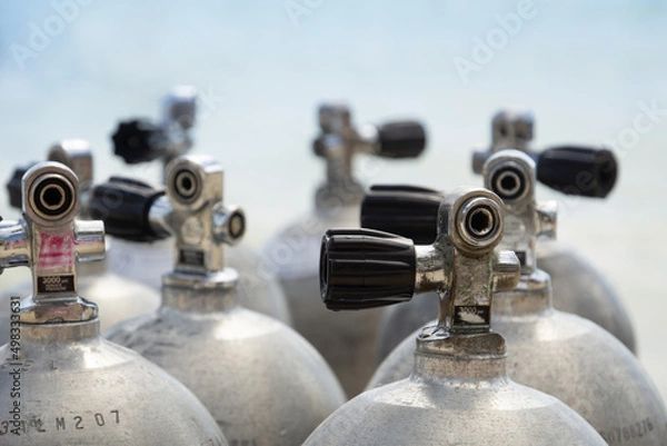 Fototapeta Valves of oxygen cylinders for diving close-up. Oxygen cylinders on the background of the sea. Scuba diving.