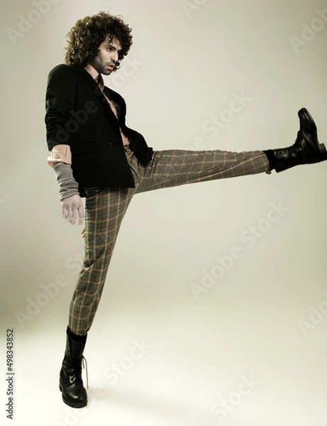 Fototapeta Fashion Model Posing, And  and Looking Confident In Studio