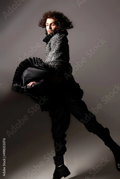 Fototapeta Fashion Model Posing, And  and Looking Confident In Studio