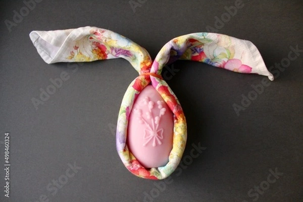 Fototapeta Easter eggs shaped candles. Soy wax blend hand-poured candles for easter decoration