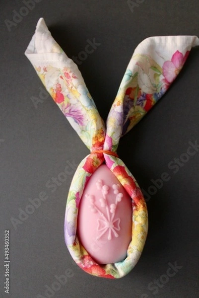 Fototapeta Easter eggs shaped candles. Soy wax blend hand-poured candles for easter decoration
