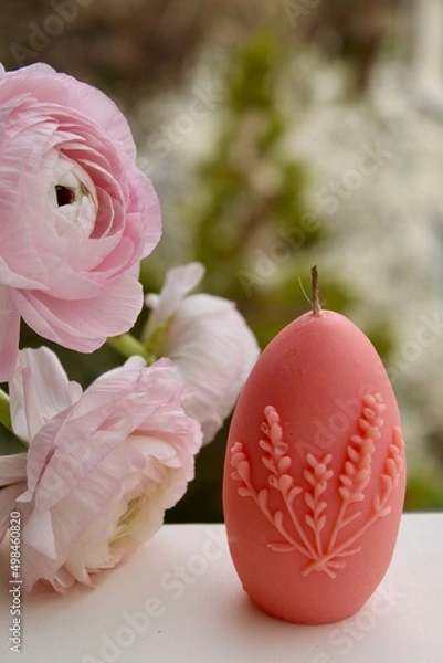 Fototapeta Easter eggs shaped candles. Soy wax blend hand-poured candles for easter decoration