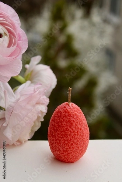 Fototapeta Easter eggs shaped candles. Soy wax blend hand-poured candles for easter decoration