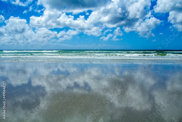 Obraz clouds over the reflective beach