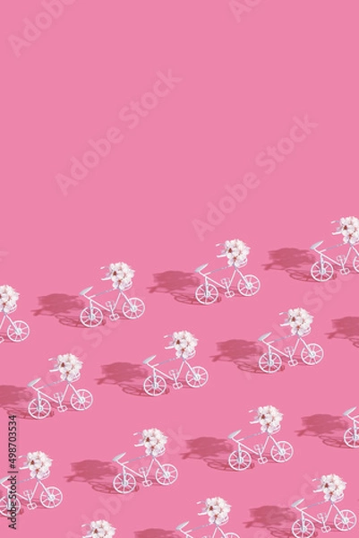 Fototapeta Patternn with decorative bicycles with flowers on pink background. Vertical format with copy space