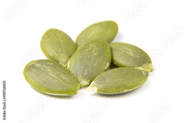 Fototapeta Pumpkin seeds macro view isolated on a white background. Healthy raw food