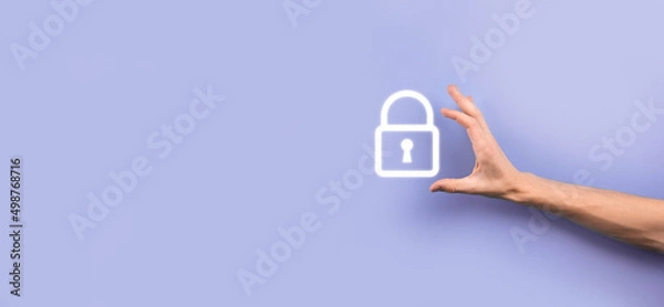 Fototapeta Male hand holding a lock padlock icon.Cyber security network. Internet technology networking.Protecting data personal information on tablet. Data protection privacy concept. GDPR. EU.Banner