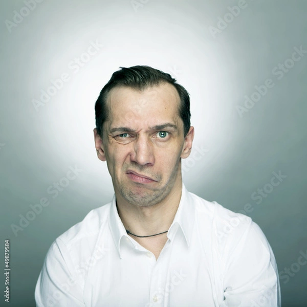 Obraz Annoyed man making a grimace