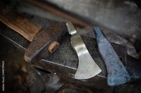 Fototapeta process with axe making by blacksmith