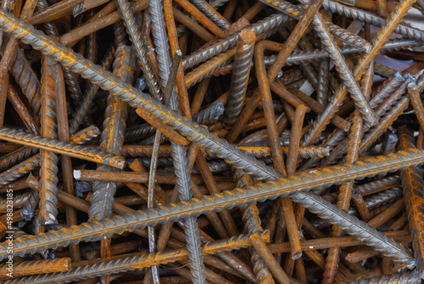 Fototapeta Reinforcement steel rod at construction site. Construction rebar steel work reinforcement. Rebar texture. Reinforcement steel rod. Rusty rebar for concrete pouring