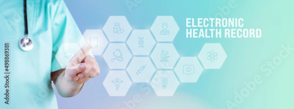 Fototapeta Electronic health record (EHR). Male doctor pointing finger at digital hologram made of icons. Text with medical term. Concept for digitalization in medicine