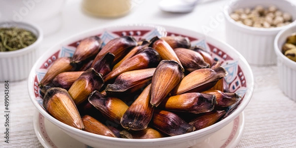 Fototapeta pinhão seed, typical Brazilian seed, served cooked. Food rich in minerals, healthy and consumed in winter