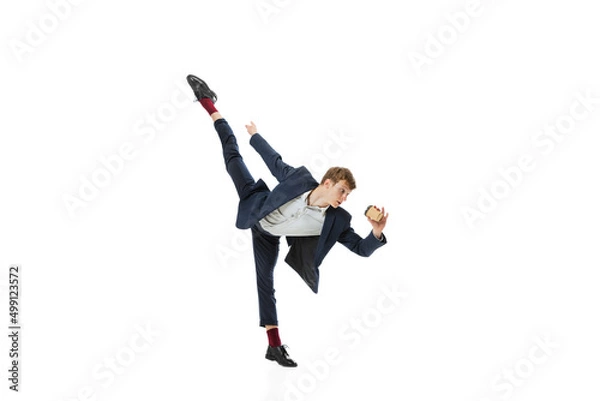Fototapeta Man in office style clothes dancing with coffee to go isolated on white studio background. Business, start-up, open-space, inspiration concept.