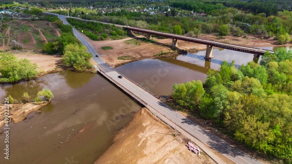 Fototapeta railway and road bridges across the river from a height, summer, sunny weather
