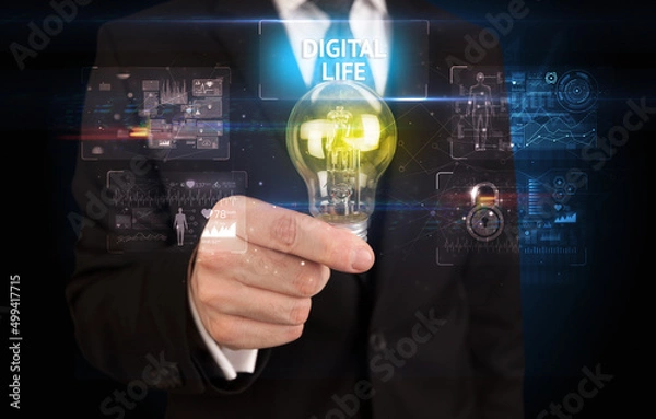 Fototapeta Businessman holding a light bulb, online security concept
