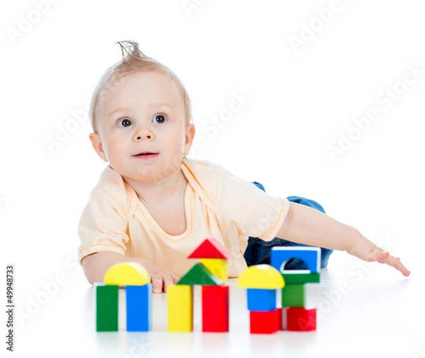 Fototapeta little child playing with building blocks