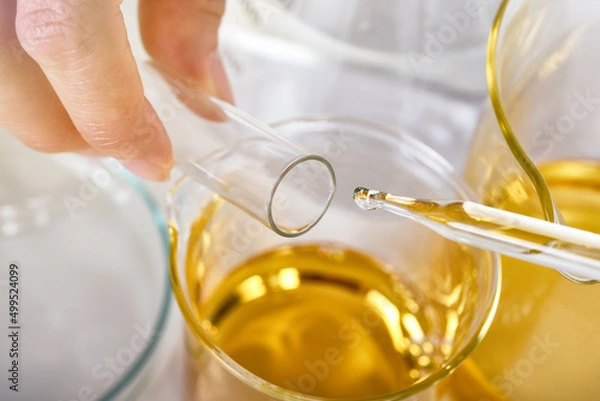 Fototapeta Oil dropping, Chemical reagent mixing, Laboratory and science experiments, Formulating the chemical for medical research, Quality control of petroleum industry products concept.