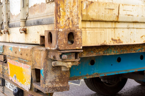 Fototapeta rusty body of an old truck oxidized in places where the paint is scratched