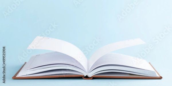 Fototapeta Notepad over blue background