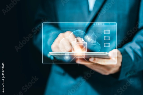 Fototapeta Businessman using tablet computer with cloud networking system, big data storage, information technology innovation and digital transformation