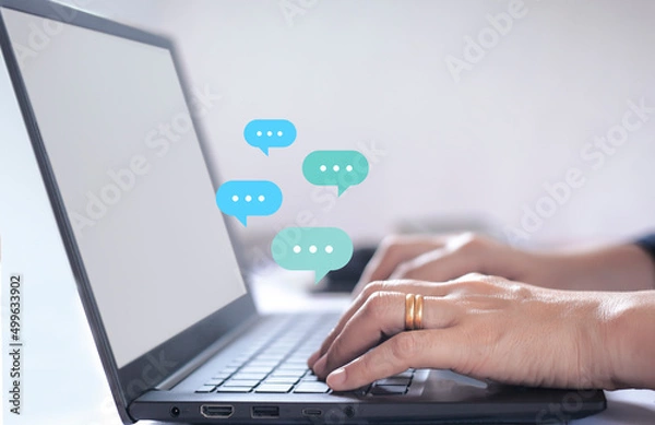 Fototapeta woman using laptop computer on desk Live chat online on communication websites, digital media applications and social networks.
