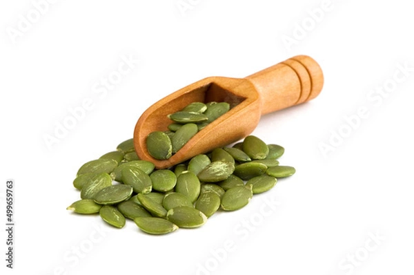 Obraz Peeled pumpkin seeds in scoop isolated on a white background. Raw shelled pumpkin seeds