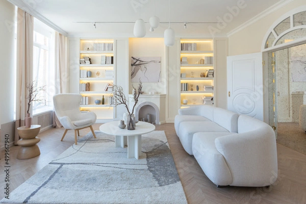 Fototapeta fashionable modern design luxury apartment in light colors. bright day behind huge windows. stylish decoration and no one inside.