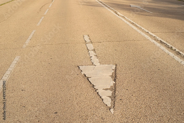 Fototapeta Pavement signs in the sunset