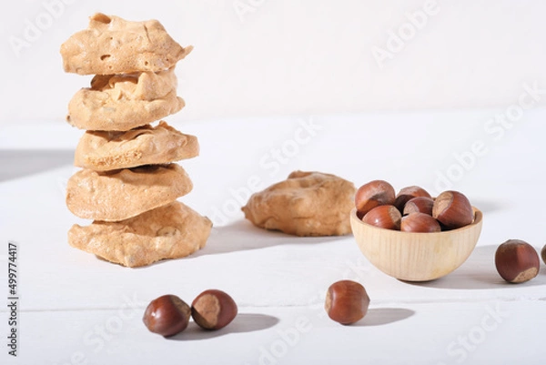 Fototapeta stack of Ugly but good,famous Italian Piedmont cookies. Italian cuisine, cooking, traditional baking with egg and nuts. brutti ma buoni