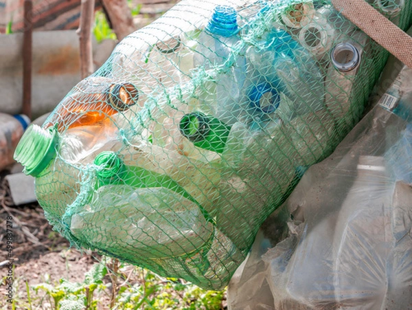 Obraz plastic bottles recycled pressed in a mesh