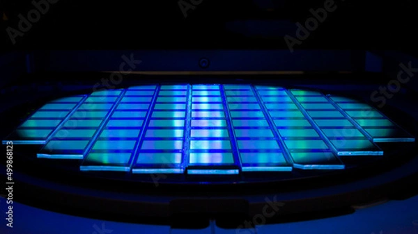 Fototapeta Silicon wafer with chips in UV lighting. Neon. Ultraviolet Lithography.