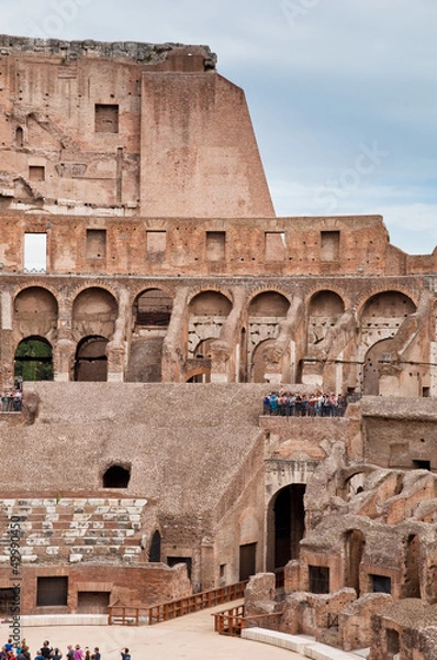Fototapeta Walls and arcs inside Colosseum at Rome
