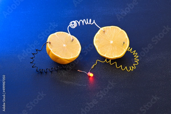 Obraz Free energy electricity generator using Lemon in blue light.